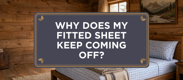 Charcoal crest header reading Why Does My Fitted Sheet Keep Coming Off over a rustic cabin bedroom with a bed dressed in Gingham organic bamboo viscose The One Sheet